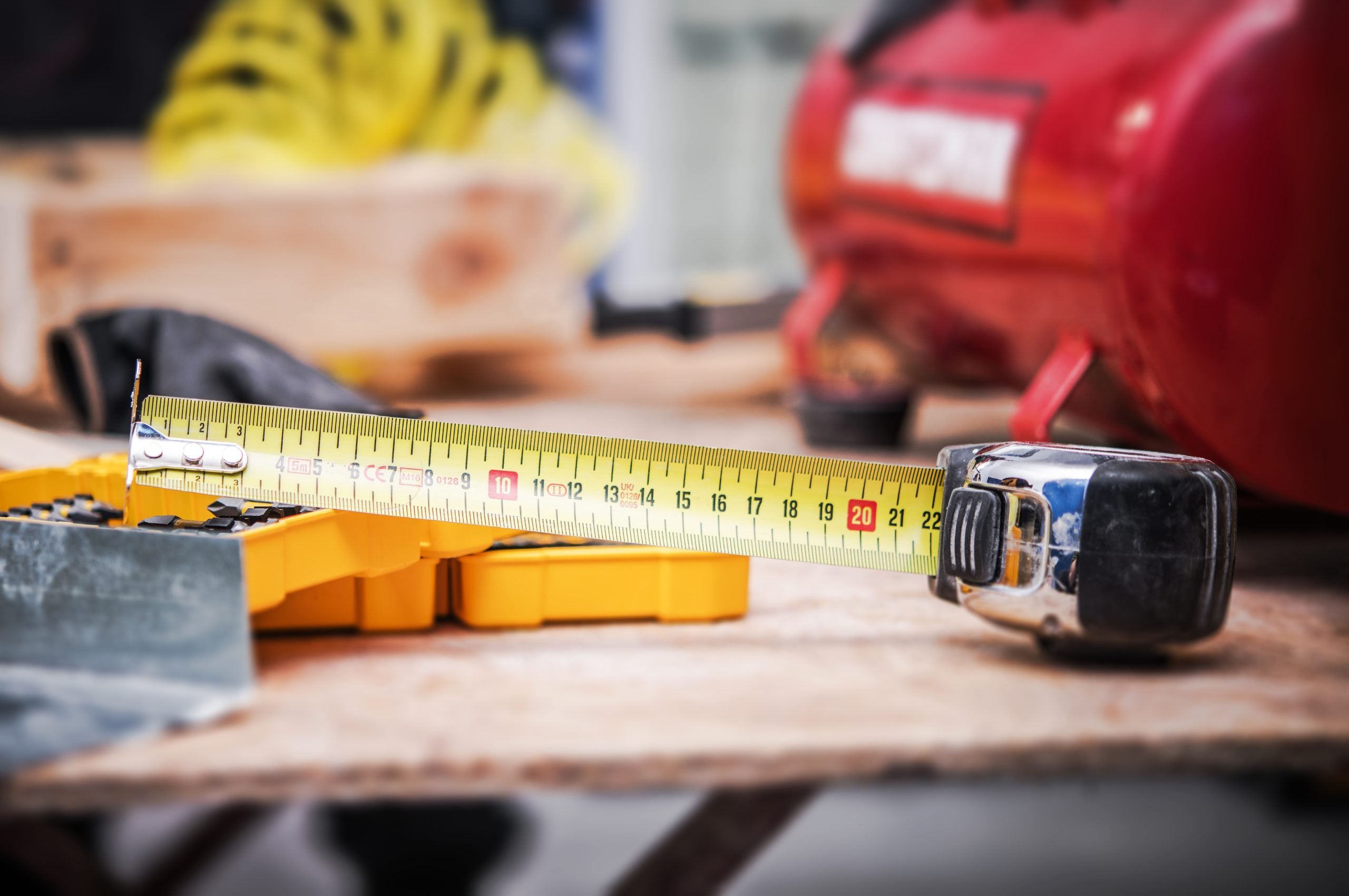 Measuring Tape and Other Tools Handful in Time of House Renovation.