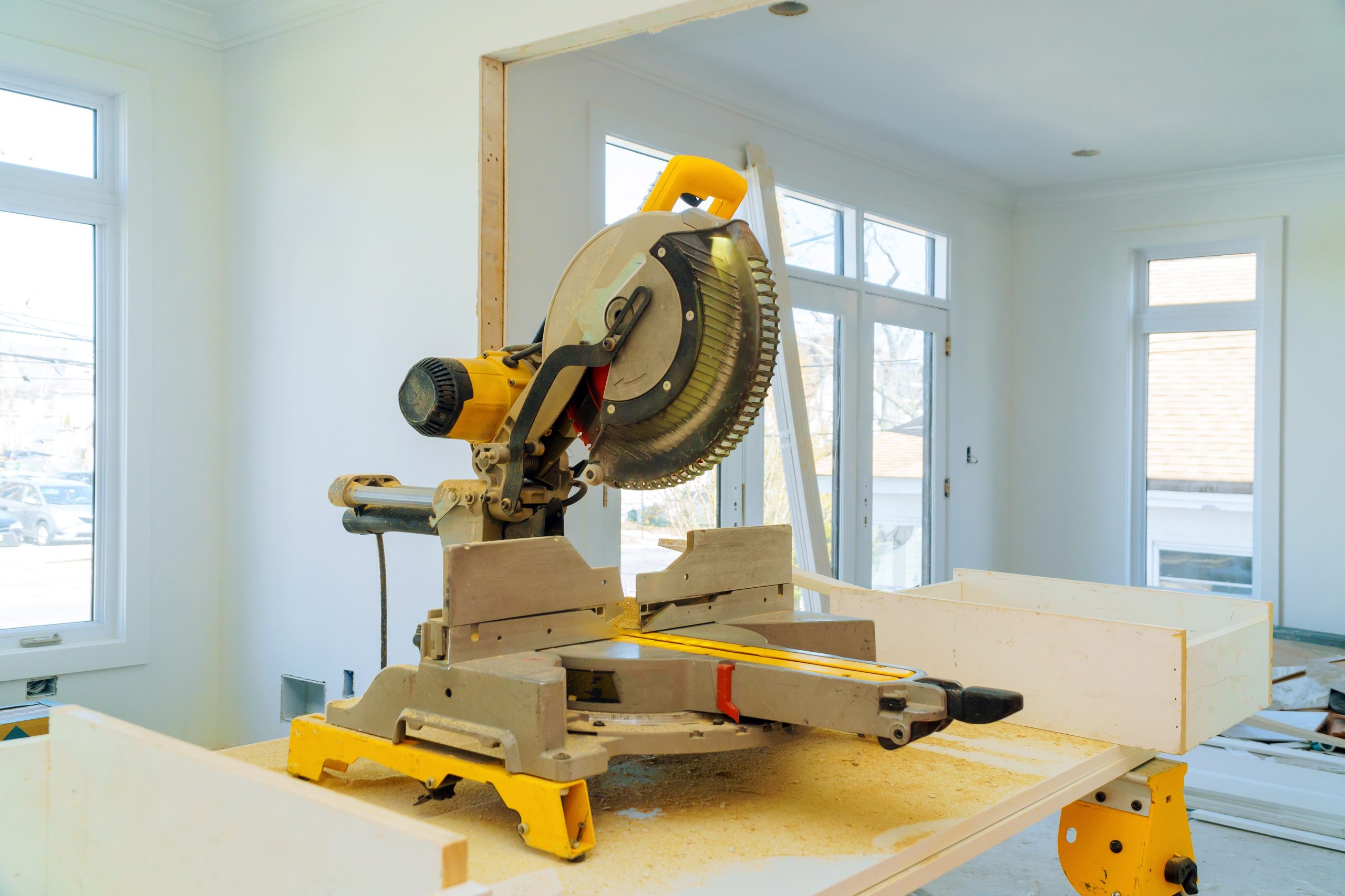 Construction remodeling home cutting wooden trim board on with circular saw